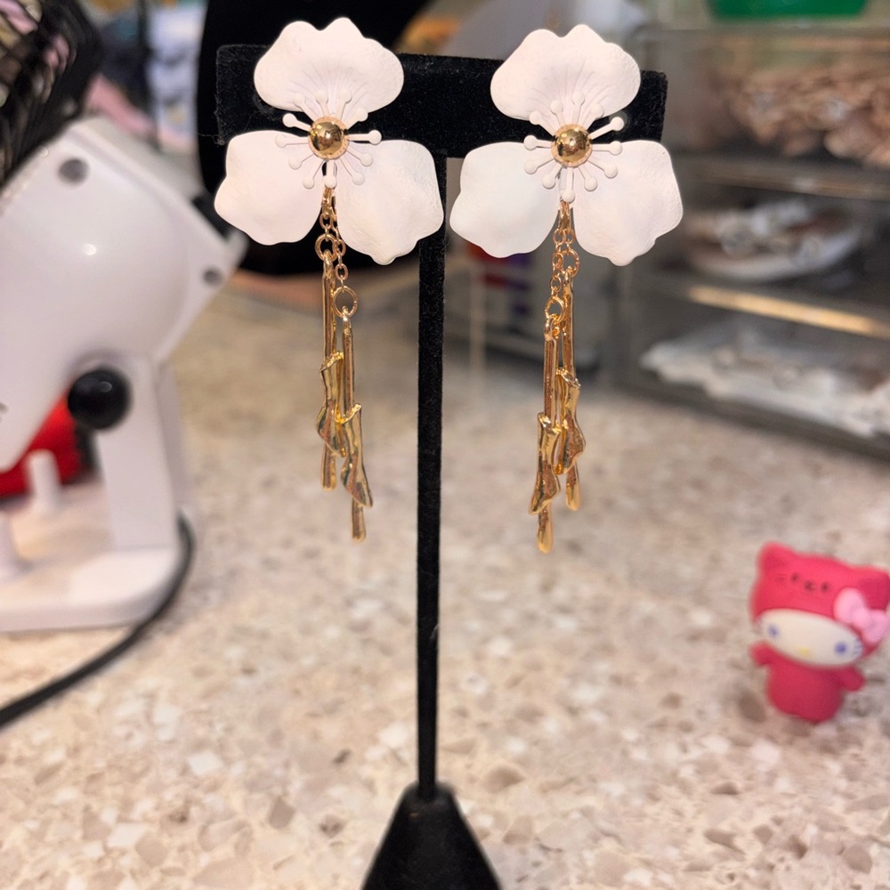 White Floral Drop Earrings with Gold Tassel Accent